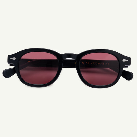 Black sunglasses with red-tinted lenses on a white background