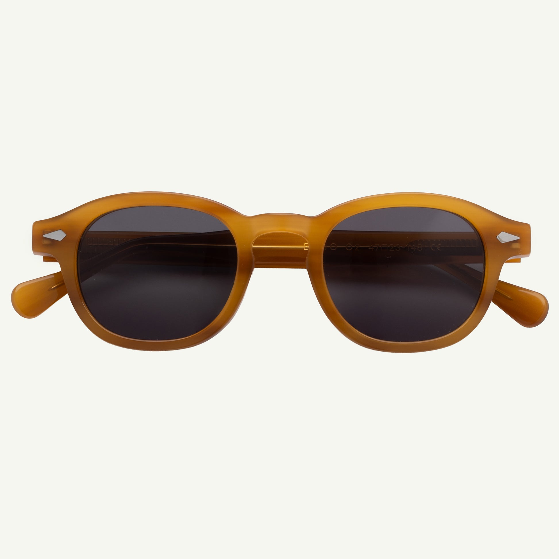 Brown sunglasses with dark lenses on a white background