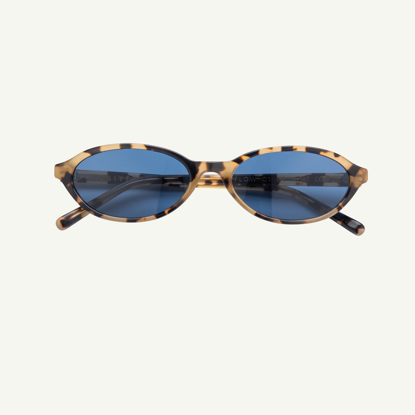 Sunglasses with tortoiseshell frame and blue lenses on a white background