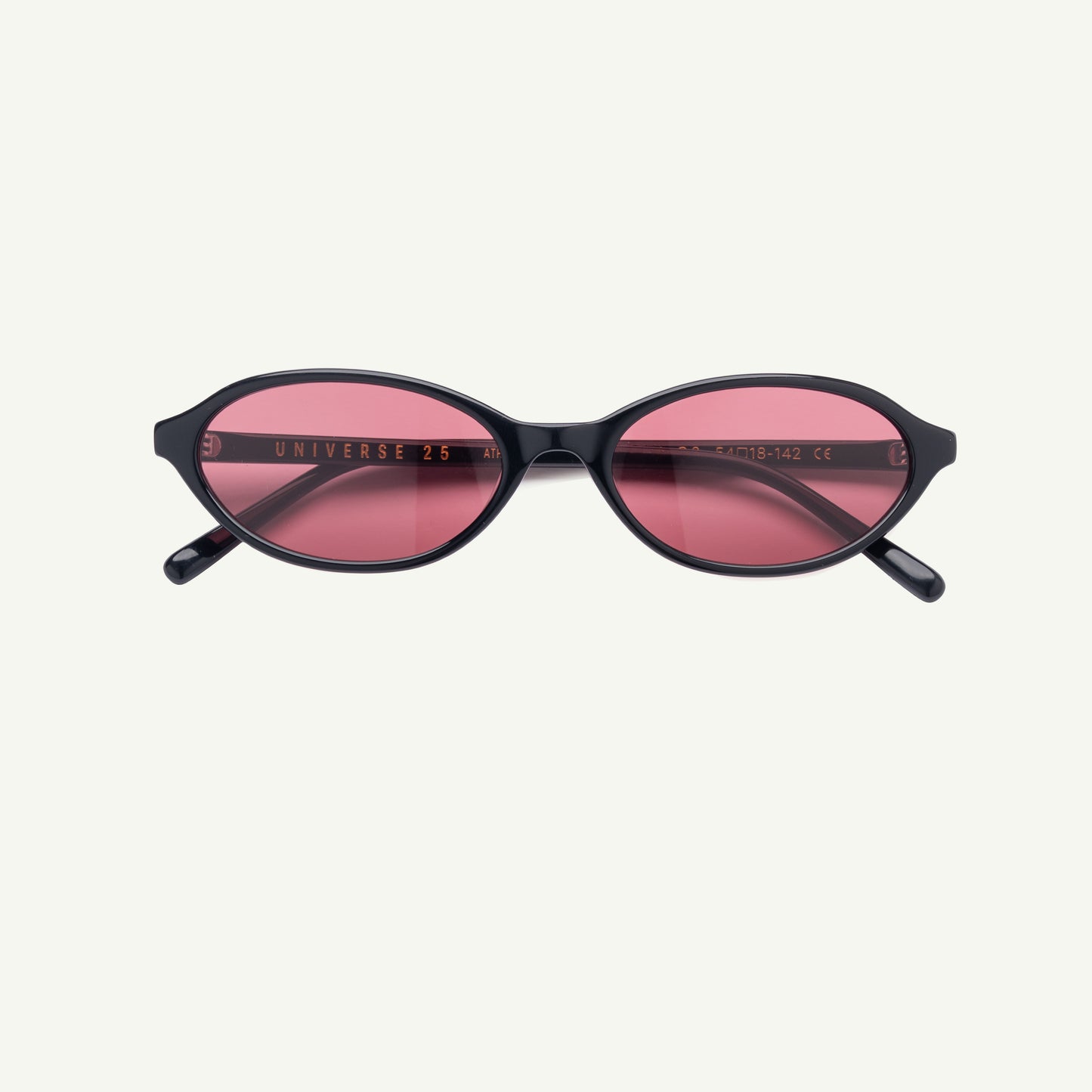 Sunglasses with black frame and pink lenses on a white background